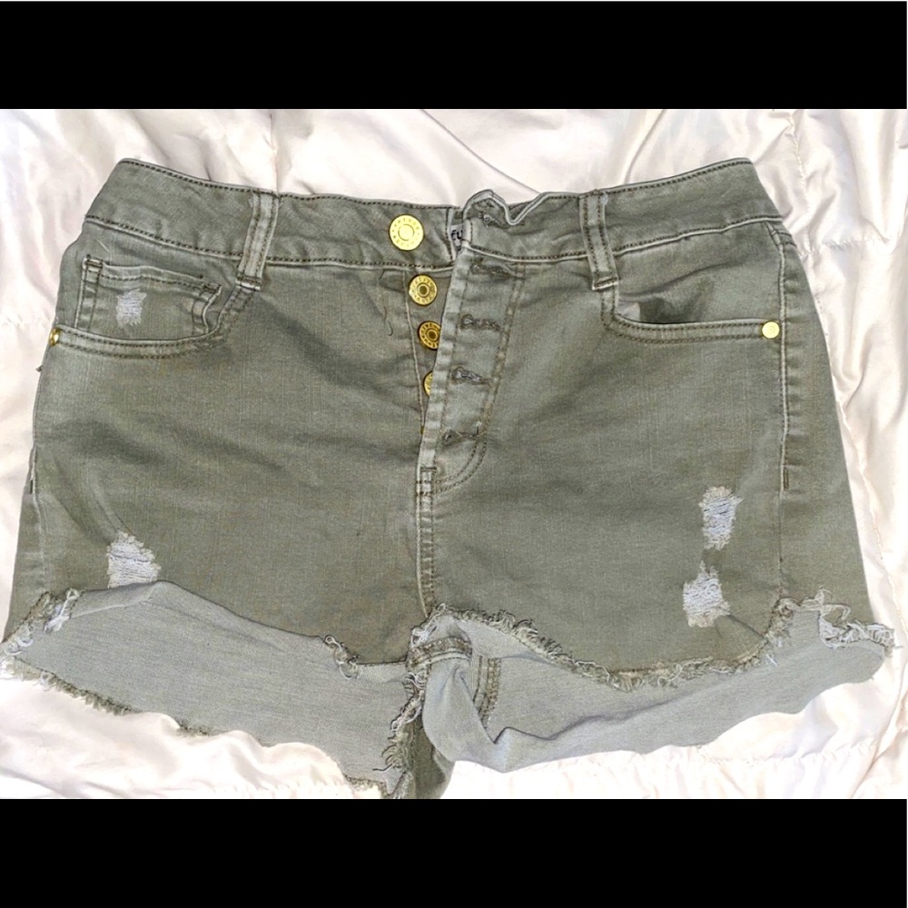 Ripped green shorts